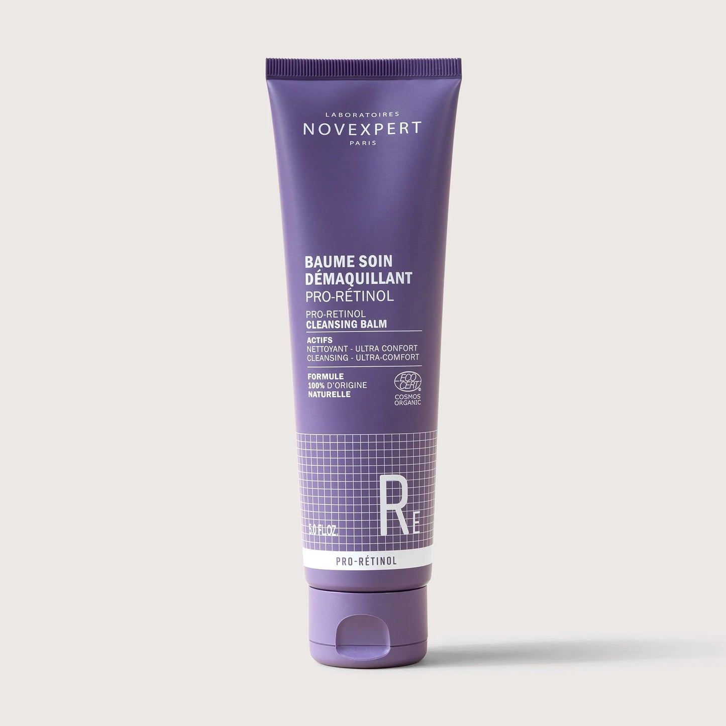 Purple tube of Novexpert cleansing balm on a white background