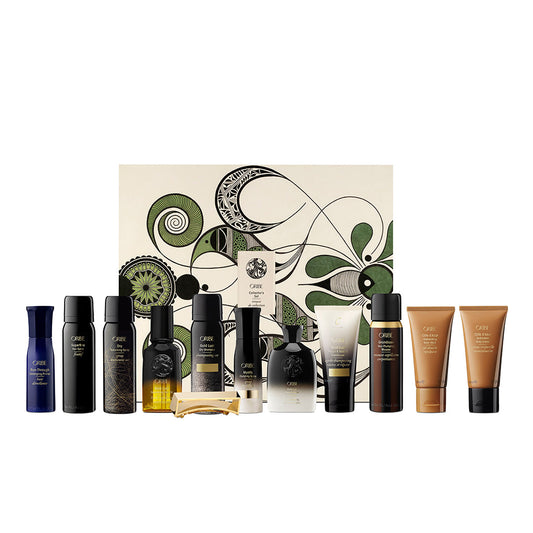 Collection of Oribe Haircare and grooming products with a decorative box on a white background