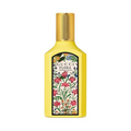 Gucci Flora Eau de Parfum in a bright yellow bottle with a gold cap and a detailed botanical label featuring pink flowers and green leaves.