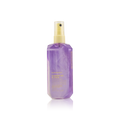 A spray bottle of Kevin Murphy Shimmer Me Blonde Repairing Shine Treatment for blondes.