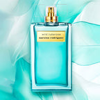 Narciso Rodriguez Wild Tuberose perfume bottle on a light blue background