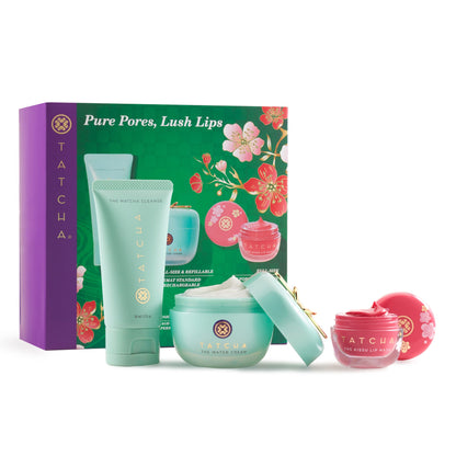 Tatcha skincare product set with green, pink, and purple packaging on a white background