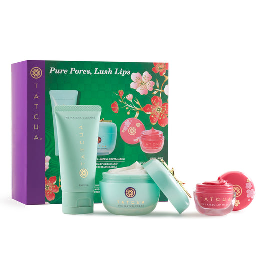 Tatcha skincare product set with green, pink, and purple packaging on a white background