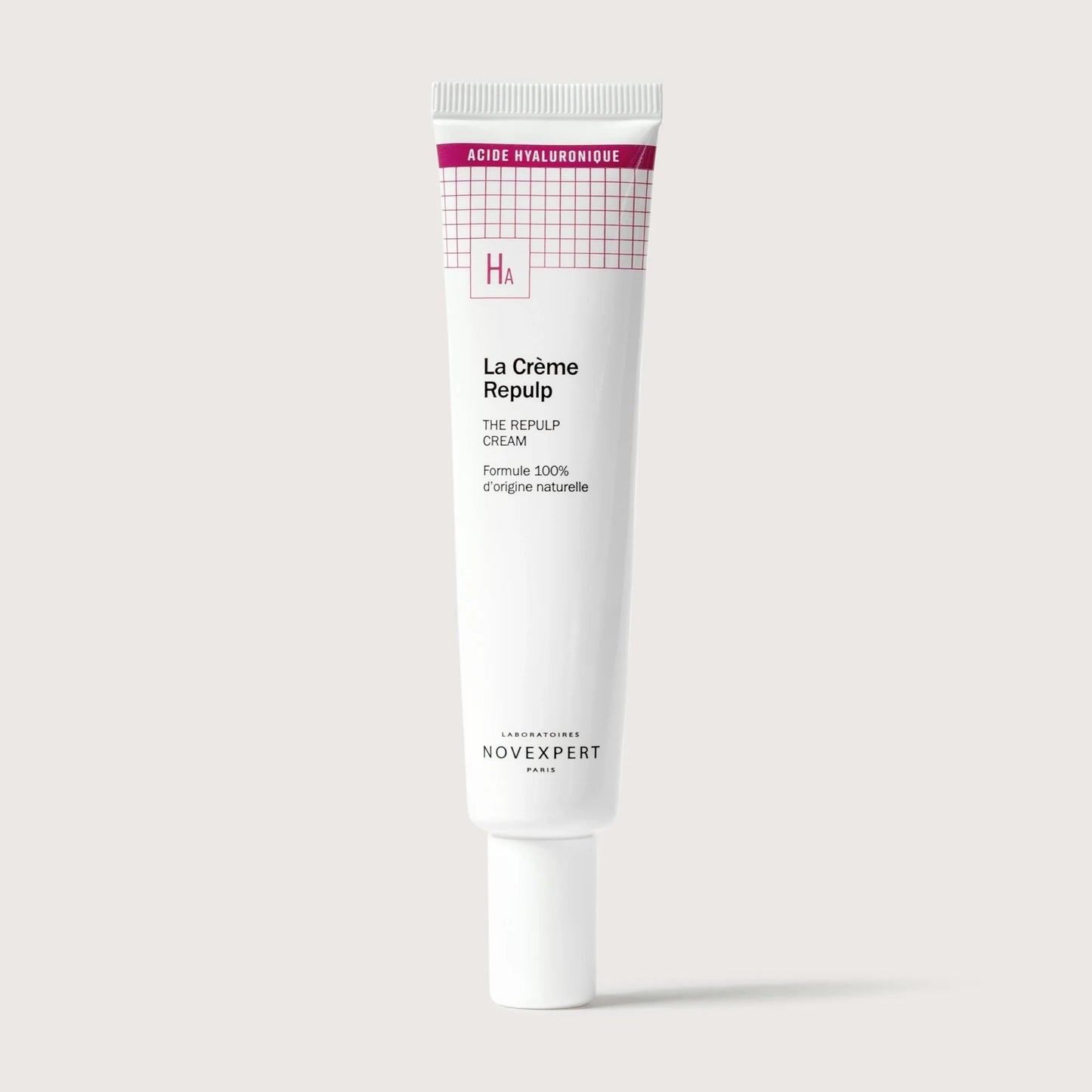 Skincare cream tube labeled 'La Crème Repulp' on a light gray background