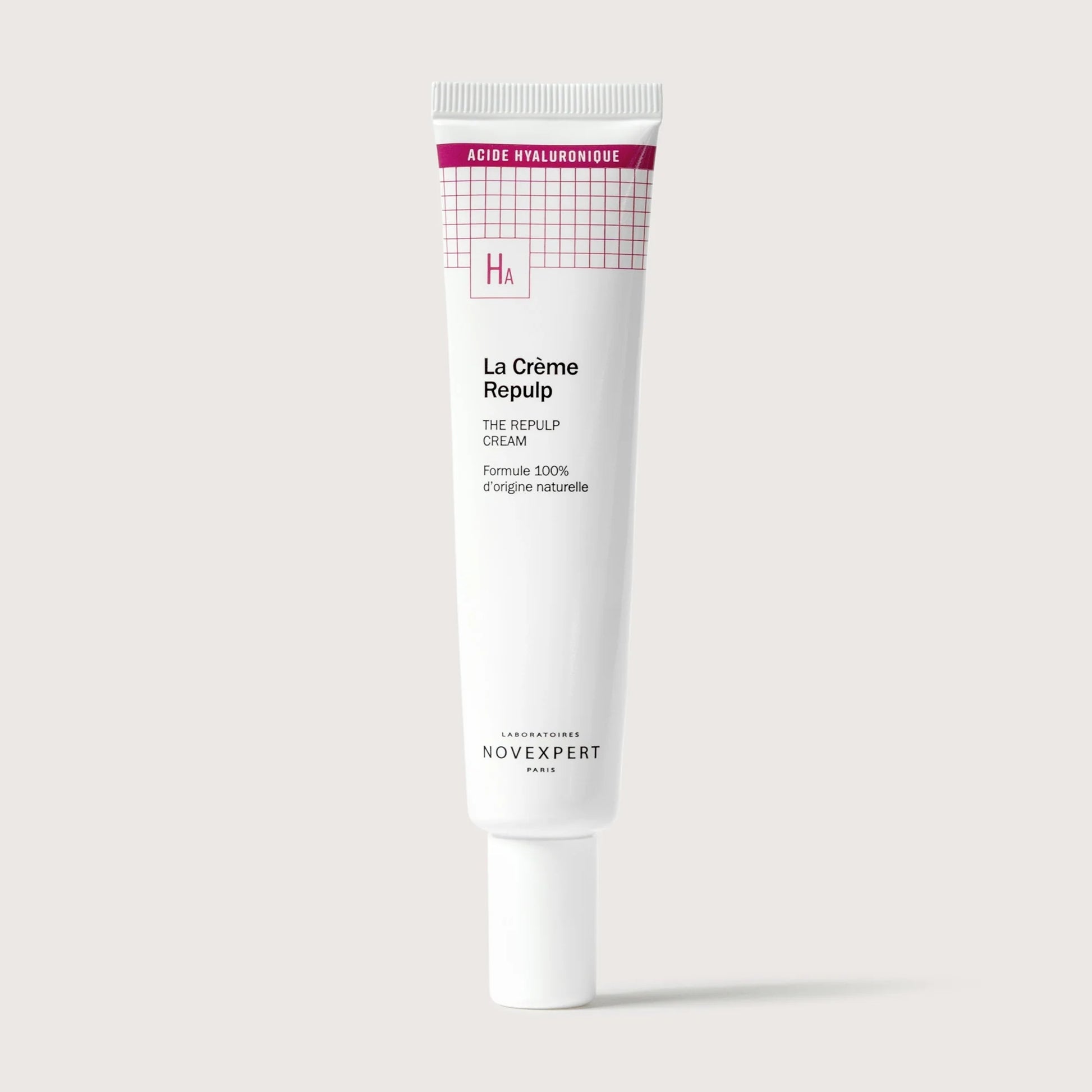Skincare cream tube labeled 'La Crème Repulp' on a light gray background