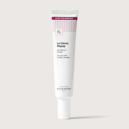 Skincare cream tube labeled 'La Crème Repulp' on a light gray background