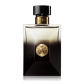 Perfume bottle with gold emblem on a white background