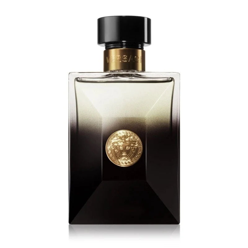 Perfume bottle with gold emblem on a white background