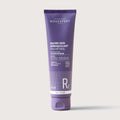 Purple tube of Novexpert cleansing balm on a white background
