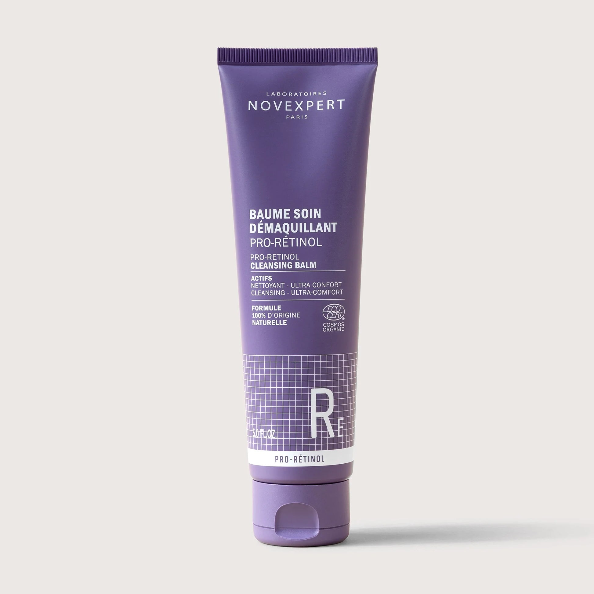 Purple tube of Novexpert cleansing balm on a white background