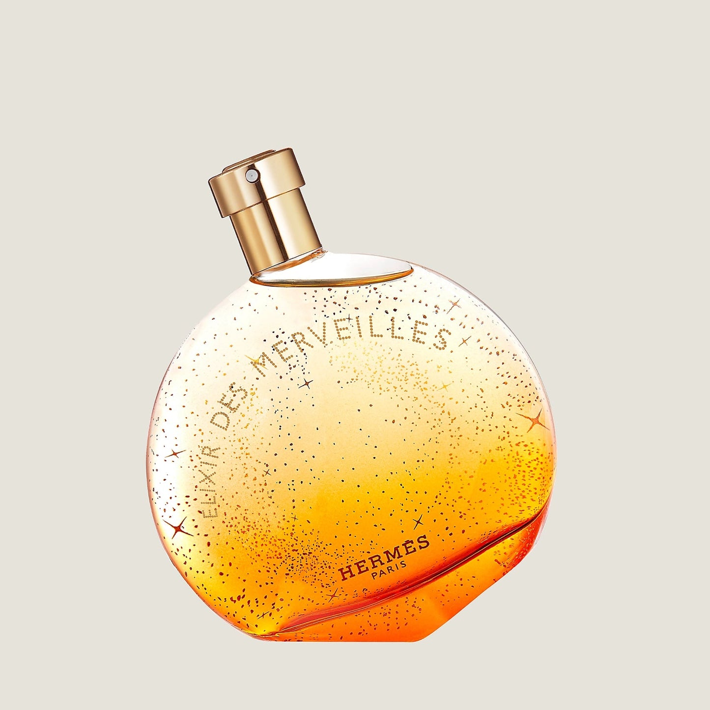 Hermes perfume bottle with gradient design on a light gray background