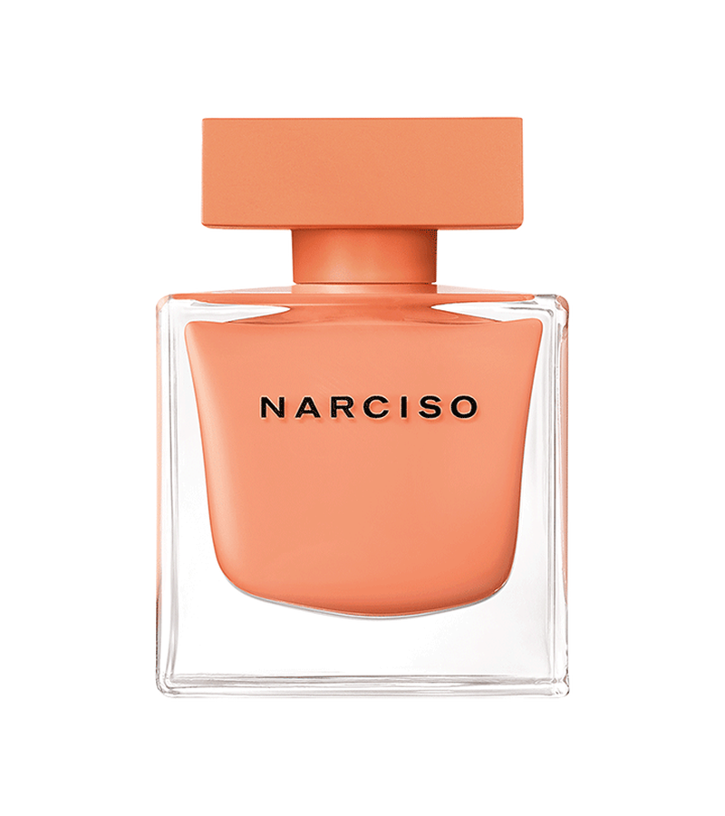 Narciso perfume bottle with a peach-colored cap and body on a white background