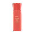 Coral bottle of Oribe Bright Blonde Radiance & Repair Treatment on a white background