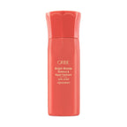 Coral bottle of Oribe Bright Blonde Radiance & Repair Treatment on a white background